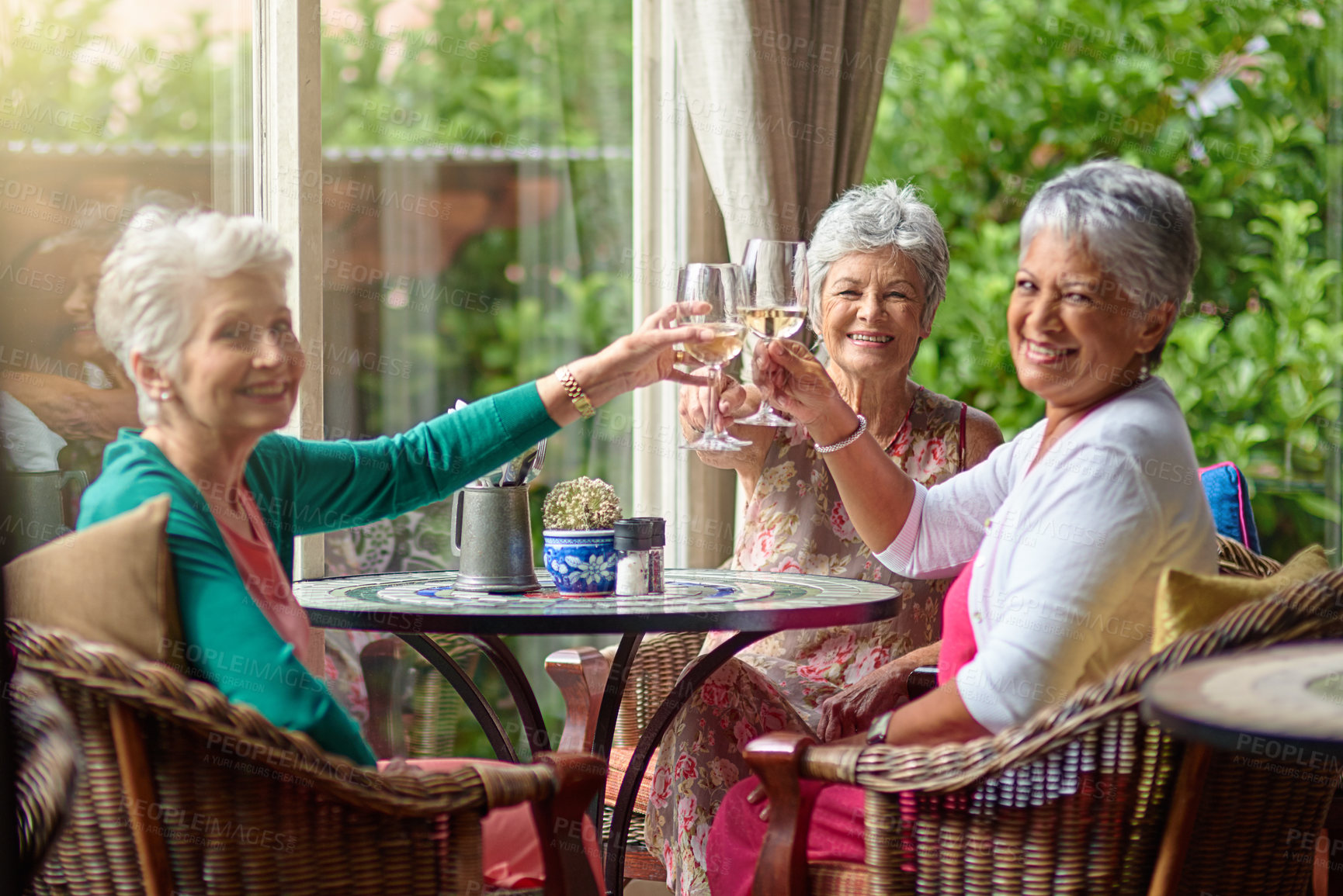 Buy stock photo Cropped shot of a group of senior female friends enjoying a lunch date