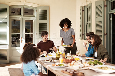 Buy stock photo Shot of a group of people sharing a meal
