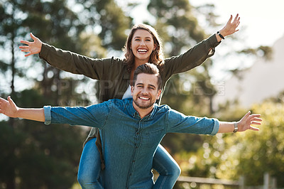Buy stock photo Cropped shot of a happy young couple spending quality time outdoors