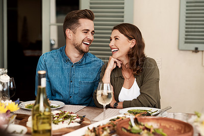 Buy stock photo Cropped shot of a couple enjoying a meal together in the yard at home