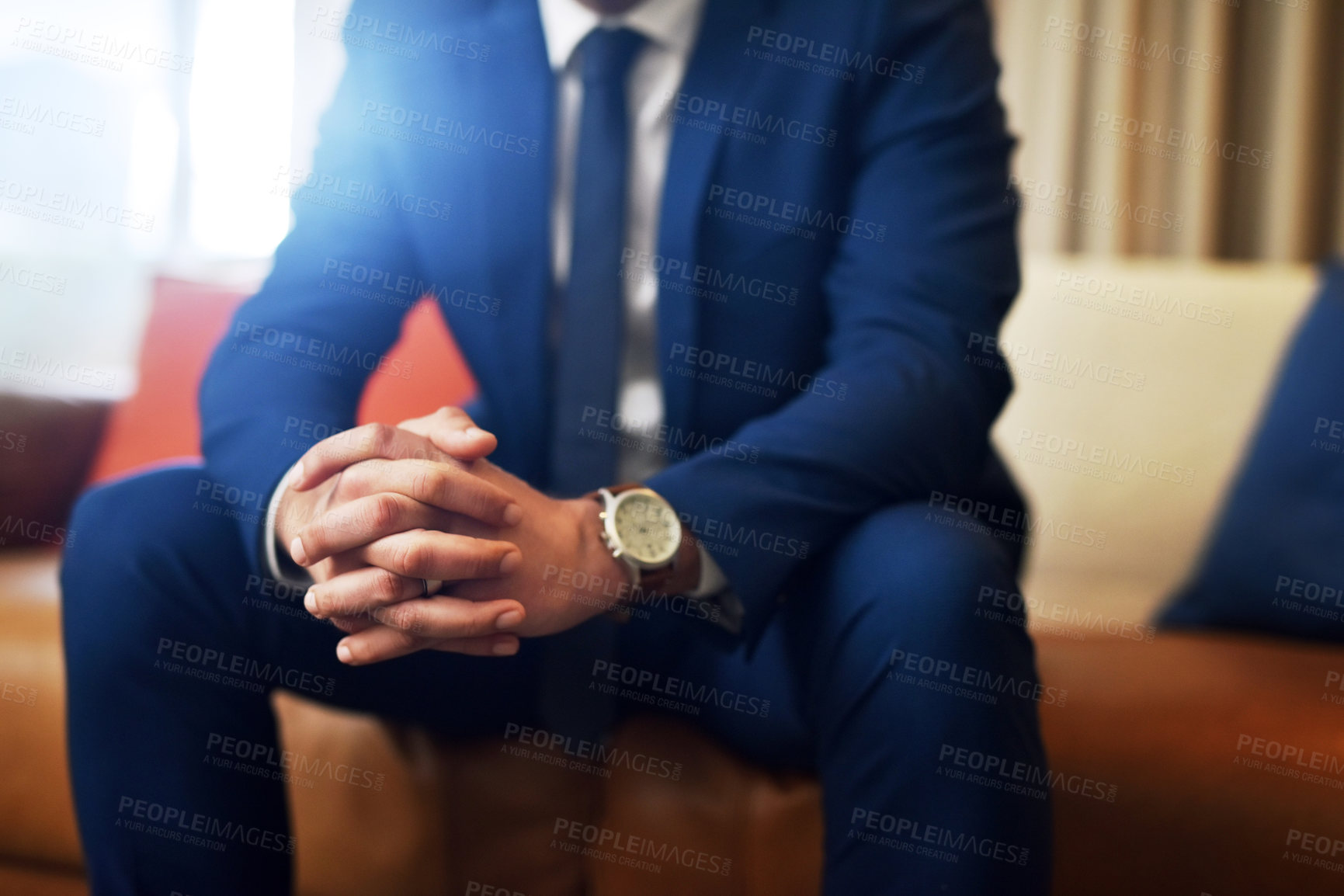 Buy stock photo Shot of an unrecognizable and stylish man sitting on a couch indoors
