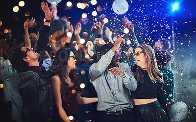 Buy stock photo Confetti, people and dance at festival for New Year celebration with smile and fun at nightclub. Music, disco lights and excited for concert with entertainment for memories, break and enjoy party