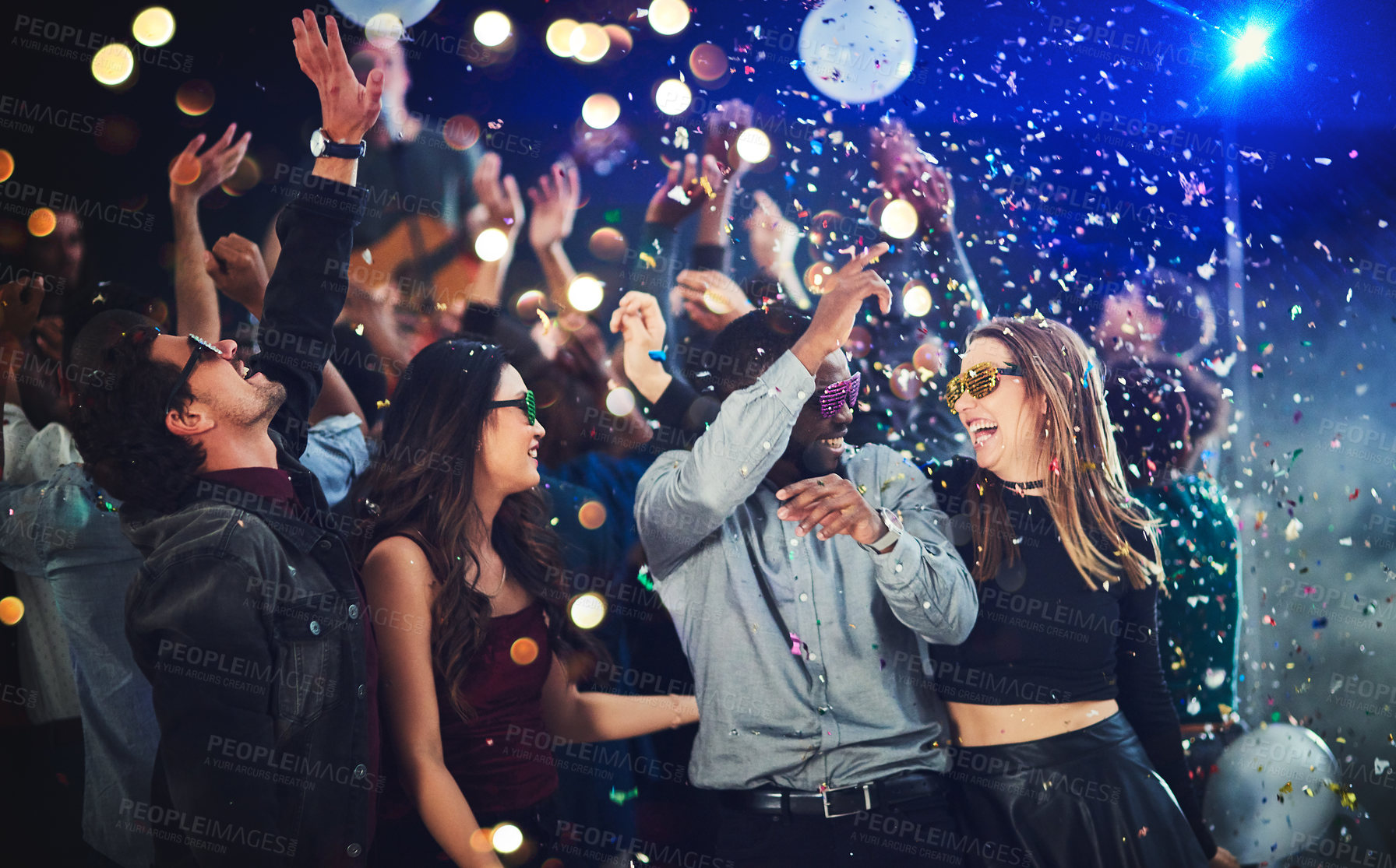 Buy stock photo Confetti, people and dance at festival for New Year celebration with smile and fun at nightclub. Music, disco lights and excited for concert with entertainment for memories, break and enjoy party