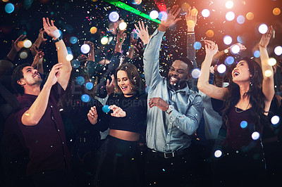 Buy stock photo Dance, music and party with friends at night for new year, festival and disco for celebration. Social, event and happy hour with people and confetti at nightclub show for rave, techno and concert