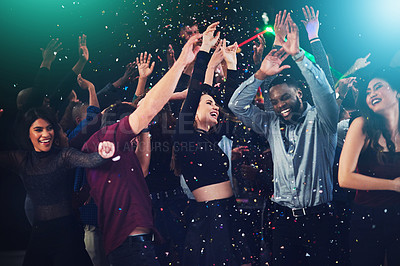 Buy stock photo Cropped shot of a diverse group off young friends dancing at a party at night