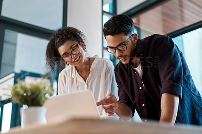 Buy stock photo Office, laptop and colleagues with glasses, pointing and together for collaboration of project online. Workplace, woman and man with teamwork, interior designer and digital for reading and business