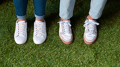 Buy stock photo Cropped shot of two unrecognizable business colleagues sitting together with their feet on the astro turf