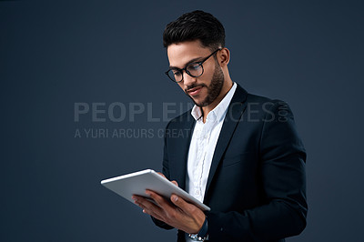 Buy stock photo Technology, professional young businessman with tablet and in a studio background. Social networking or digital communication, isolated and male person with mobile device search on backdrop.