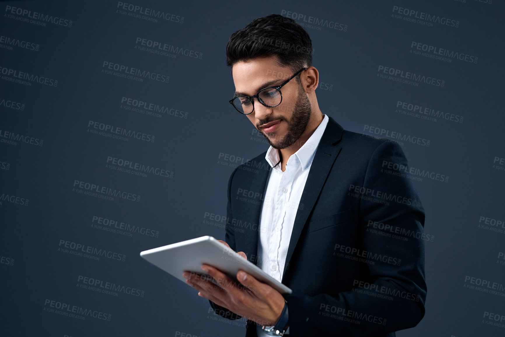 Buy stock photo Technology, professional young businessman with tablet and in a studio background. Social networking or digital communication, isolated and male person with mobile device search on backdrop.