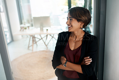 Buy stock photo Cropped shot of an attractive young businesswoman standing alone with her arms folded in the office