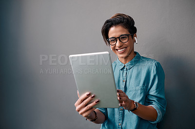 Buy stock photo Tablet, music and happy woman or student isolated on gray background for university e learning, online streaming and video. Young person on digital technology, listening to audio and electronics app
