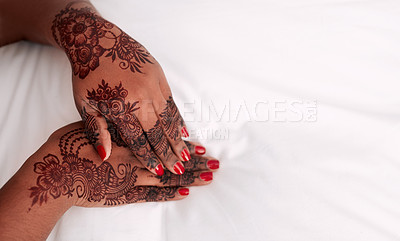 Buy stock photo Cropped shot of an unrecognizable bride showing off the mehendi on her hands on the morning of her wedding