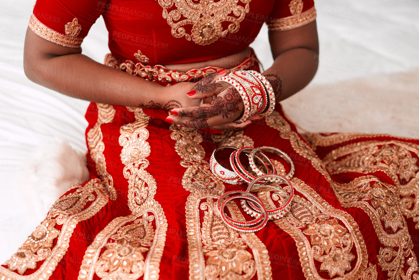 Buy stock photo Cropped shot of an unrecognizable bride putting on her bracelets in preparation for her wedding