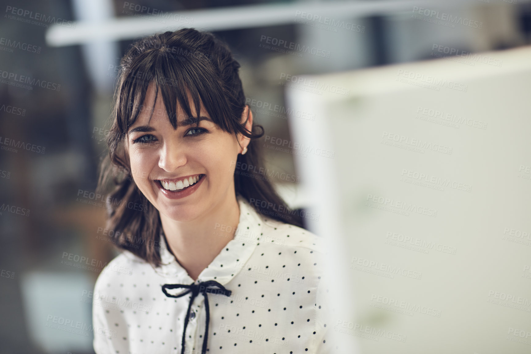 Buy stock photo Portrait of an attractive young businesswoman using a computer in a modern office