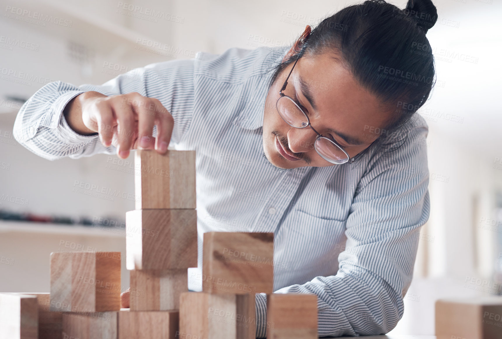Buy stock photo Building block, business and man with plan, vision challenge game and design innovation for balance at a startup. Engineering, architecture and designer with wood blocks for problem solving ideas.