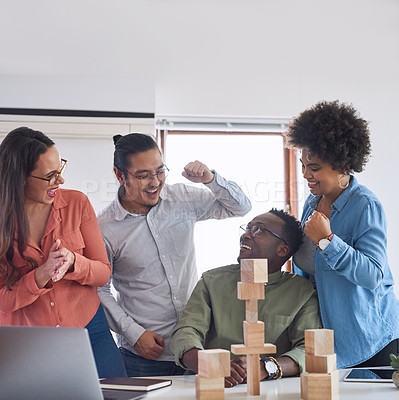 Buy stock photo Office, employees and well done on laptop with building blocks for problem solving, solution and victory. Fist pump, people and smile with game for success, project and creativity as graphic designer