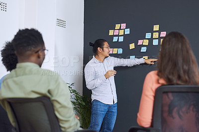 Buy stock photo Man, sticky notes and chalk board in office for training, teaching and learning for skill or career development. People, employees and mentor or leader at workshop for internship program and coaching