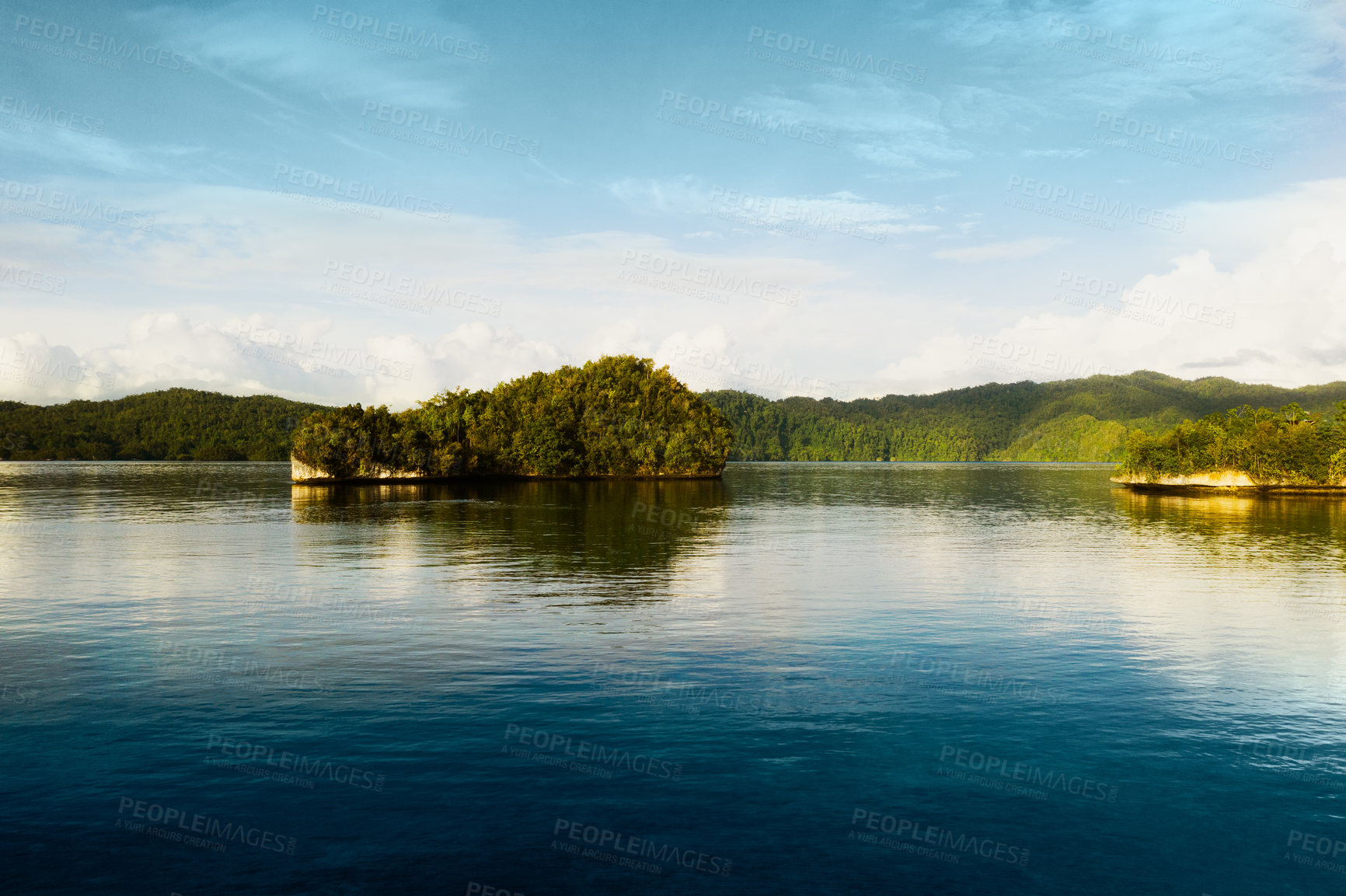 Buy stock photo Cropped shot of a beautiful island on a quiet lake