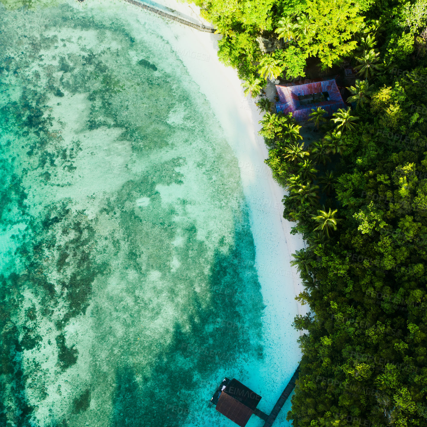 Buy stock photo High angle shot of a clear blue ocean touching the coastline