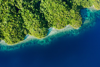 Buy stock photo High angle shot of beautiful green islands in the ocean