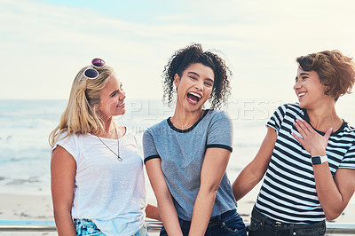 Buy stock photo Shot of three friends spending the day together on a sunny day