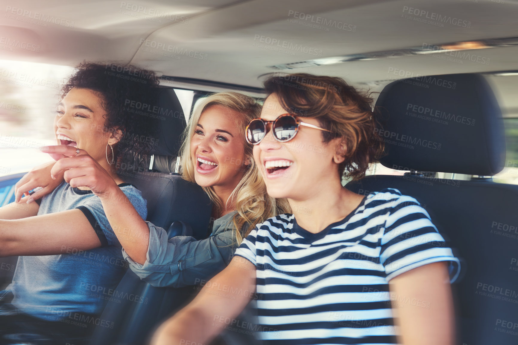 Buy stock photo Shot of girlfriends out on a road trip together