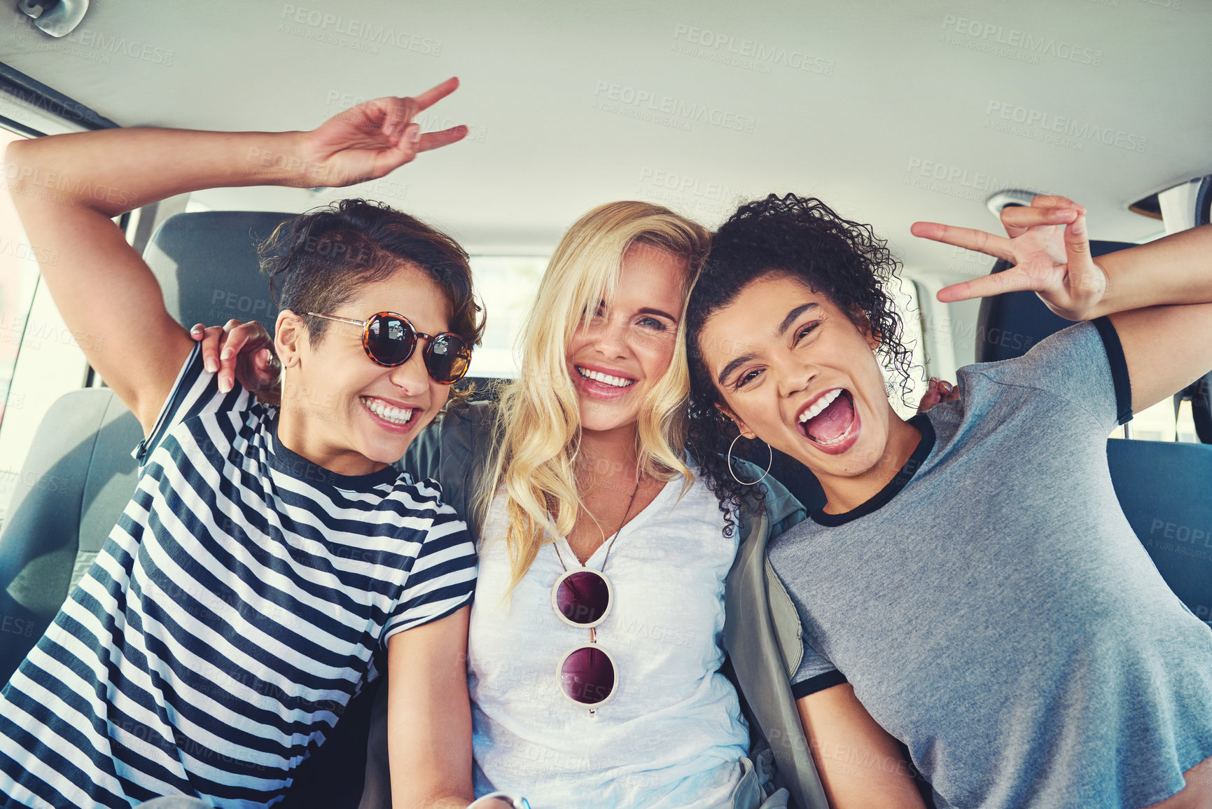 Buy stock photo Shot of girlfriends out on a road trip together