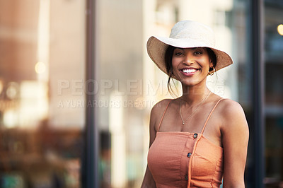 Buy stock photo Portrait of an attractive young woman feeling cheerful while out and about in the city