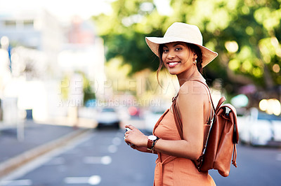Buy stock photo Portrait of an attractive young woman taking pictures with a camera while sightseeing in a  foreign city
