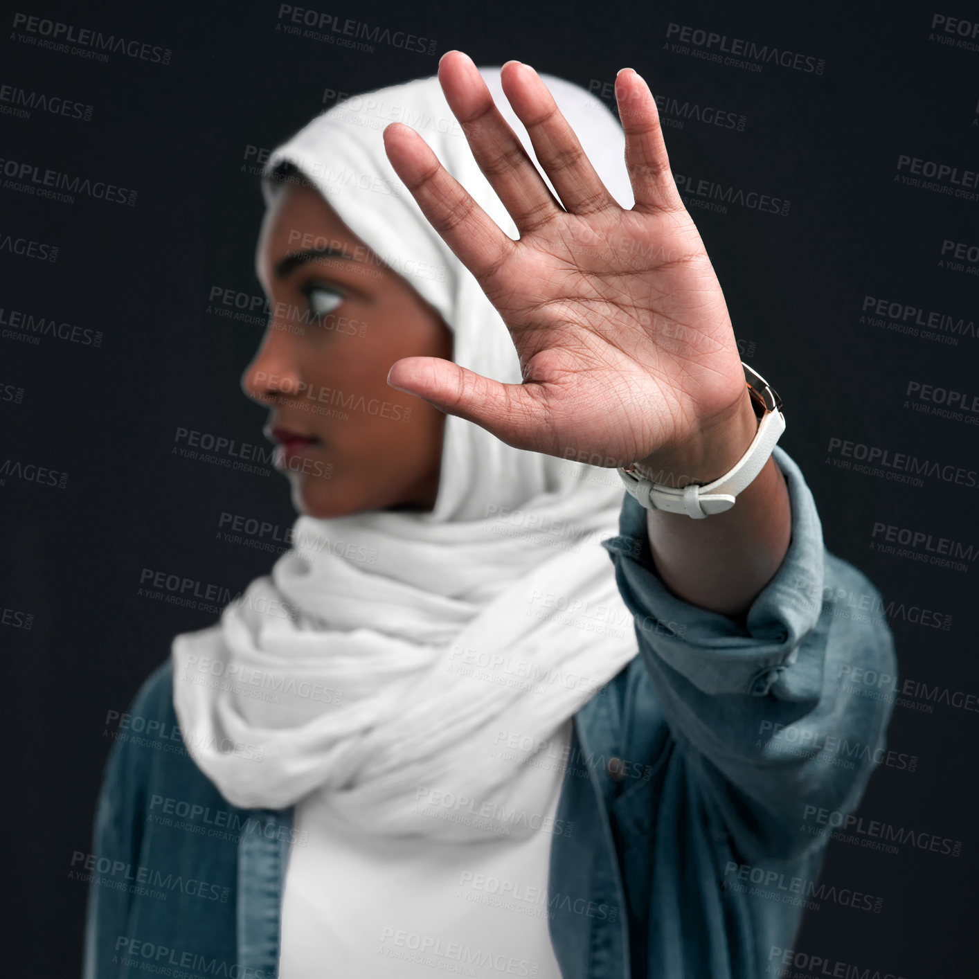 Buy stock photo Muslim, hand and woman with stop in studio for blame, discrimination or cultural ridicule on dark background. Person, hijab and Islamic girl with gesture for judgement, religion harassment or gossip