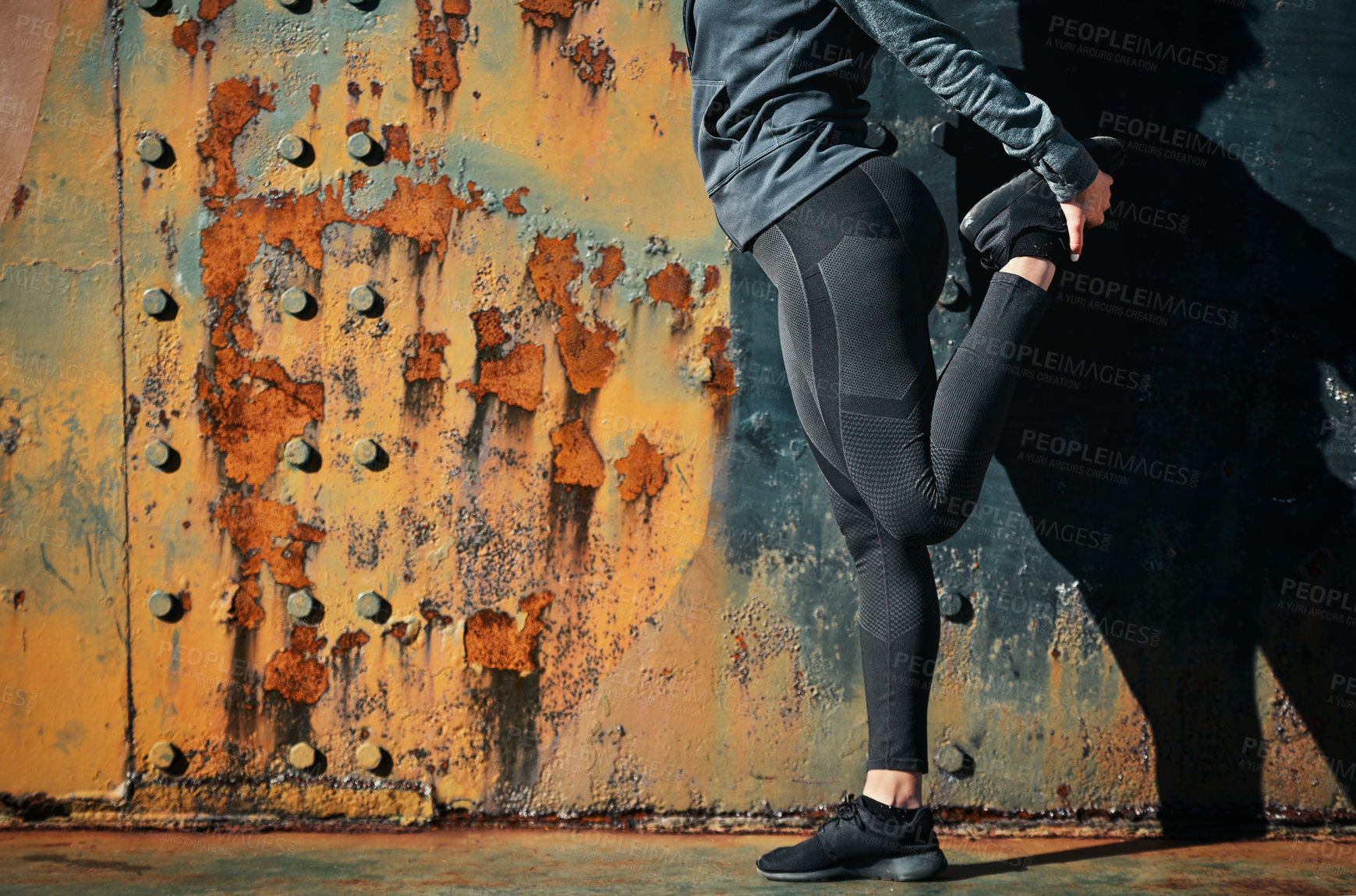 Buy stock photo Fitness, legs and wall background with sports person on space in city for training or workout. Exercise, mockup and warm up with athlete getting ready at urban location for challenge or performance