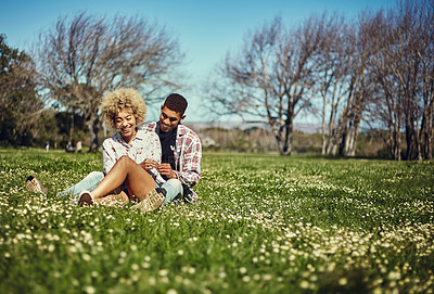 Buy stock photo Shot of a young couple spending quality time together at the park