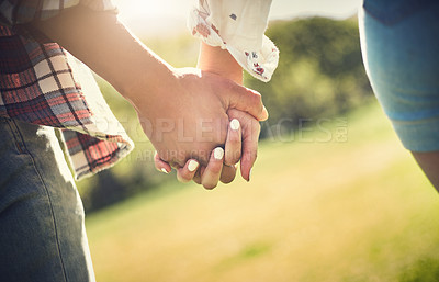 Buy stock photo Couple, park and holding hands in nature with love, support and commitment together outdoor. Girlfriend, boyfriend and people with care, romance and anniversary or engagement date outside relaxing