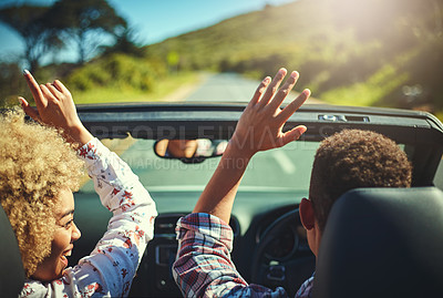 Buy stock photo Cropped shot of a happy young couple out on a road trip