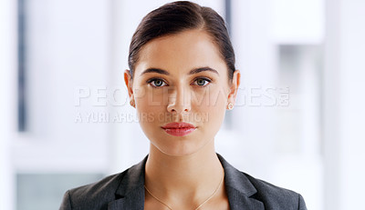 Buy stock photo Portrait of an attractive young businesswoman looking serious in her office
