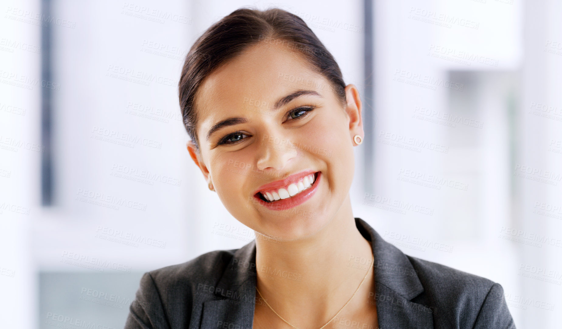 Buy stock photo Portrait of an attractive young businesswoman smiling and feeling cheerful in her office