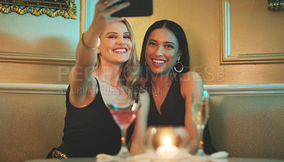 Buy stock photo Girl friends, phone and selfie at a nightclub for cocktail celebration with happy women and alcohol. Mobile photo, smile and restaurant drinks of people at a event for new year  or happy hour