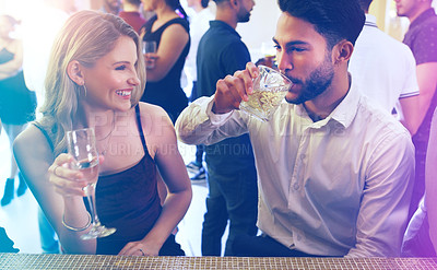 Buy stock photo Party, man and woman talking and drinking on a date to celebrate new years eve with dancing. Dating, partying and a couple of friends chat while celebrating at the disco with alcohol drinks 