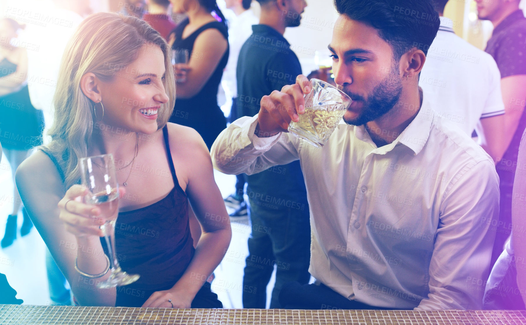 Buy stock photo Party, man and woman talking and drinking on a date to celebrate new years eve with dancing. Dating, partying and a couple of friends chat while celebrating at the disco with alcohol drinks 