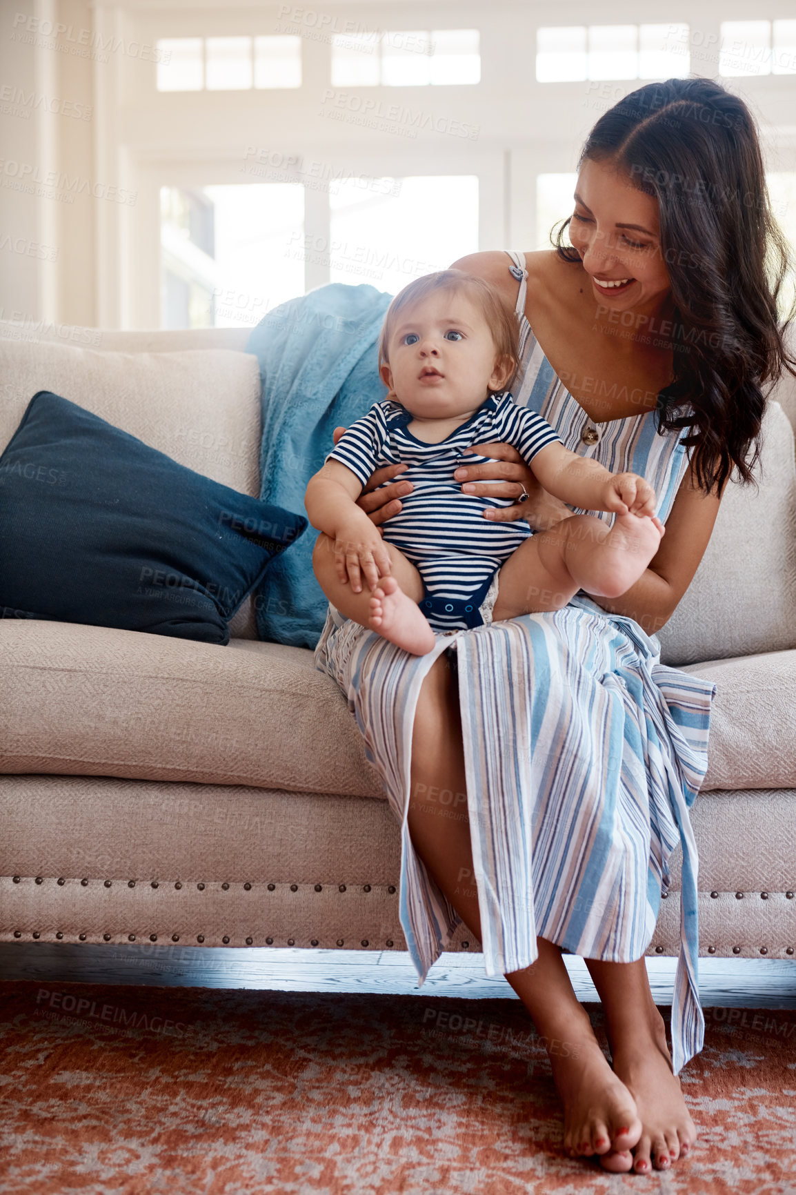 Buy stock photo Shot of a mother bonding with her baby boy at home