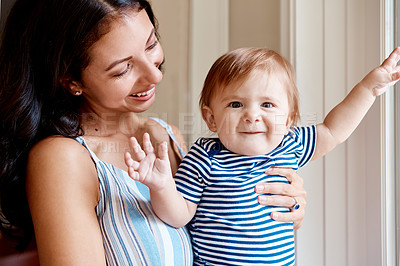 Buy stock photo Shot of a mother bonding with her baby boy at home