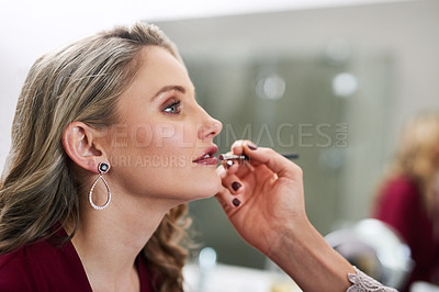 Buy stock photo Cropped shot of a beautiful young bride having her make-up done by her chief bridesmaid in preparation of her wedding