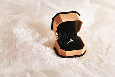Buy stock photo Still life shot of a beautiful diamond ring inside a ring box top of wedding dress