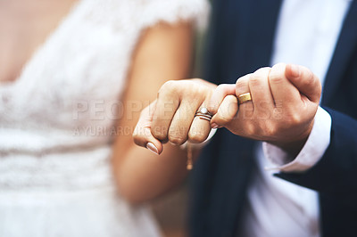 Buy stock photo Cropped shot of an unrecognizable newlywed couple doing a pinky swear gesture on their wedding day