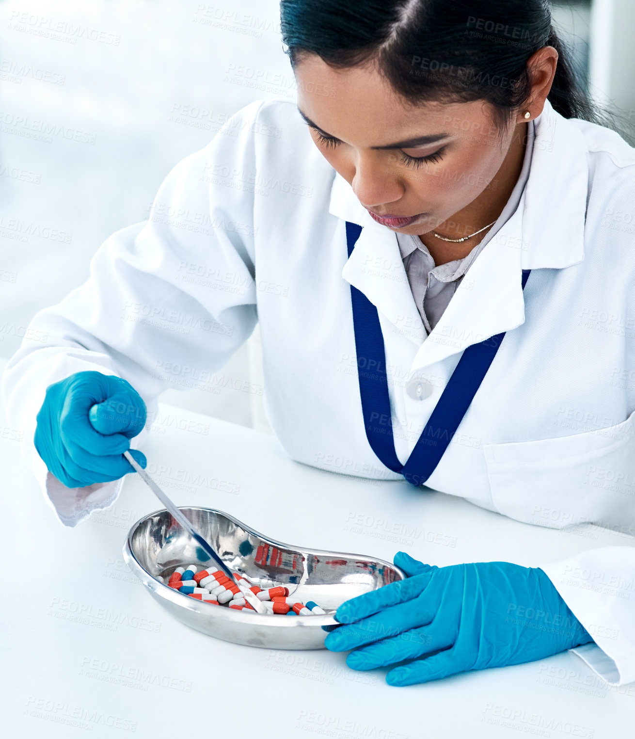 Buy stock photo Healthcare, pharmacist or woman with counting pills, tablets and supplements on stainless tray. Pharmacy, female employee and medicine for sorting, preparation and quantity check for prescription