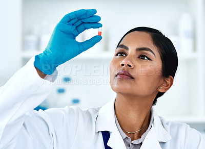 Buy stock photo Woman, pills and medical science research or scientist development for future drugs, medicine or product. Face of female worker in laboratory for pharmaceutical discovery, innovation and analysis