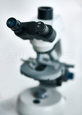 Buy stock photo Still life shot of a microscope placed in a laboratory