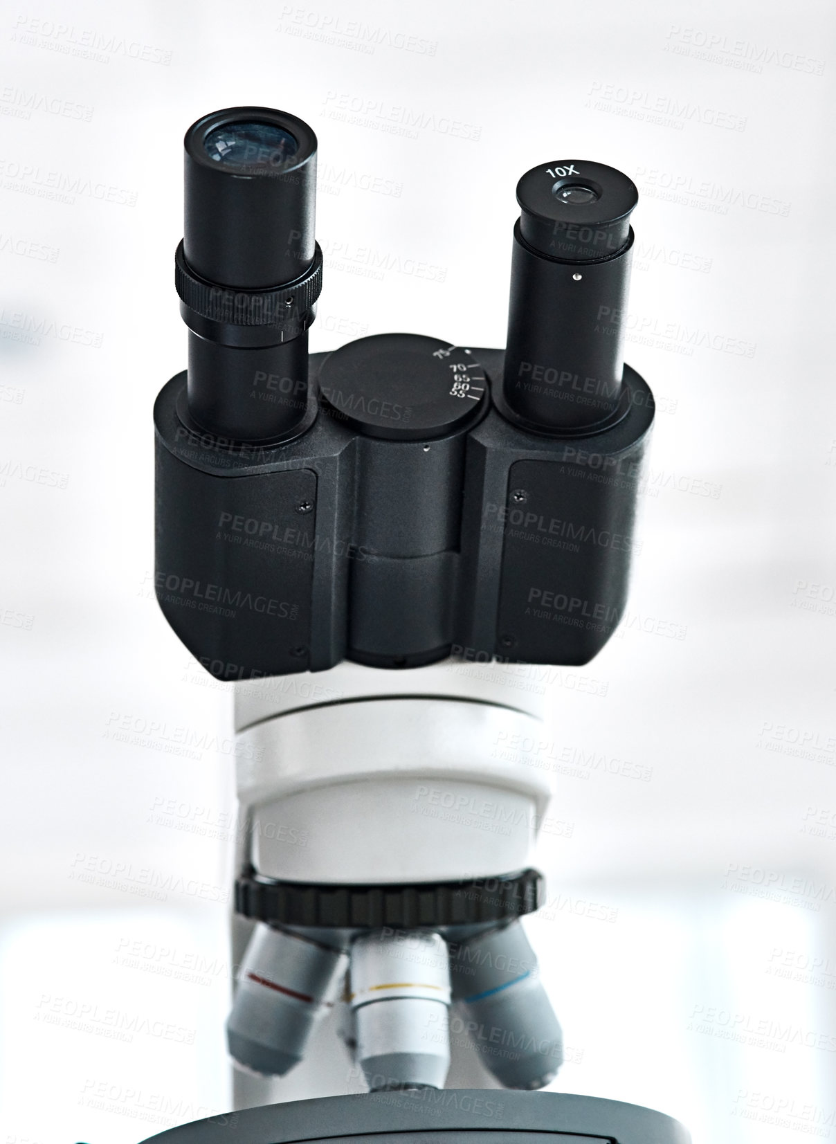 Buy stock photo Still life shot of a microscope placed in a laboratory with its eyepiece facing upwards