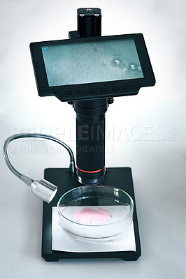 Buy stock photo Still life shot of a digital microscope showing the results of a sample liquid in a laboratory