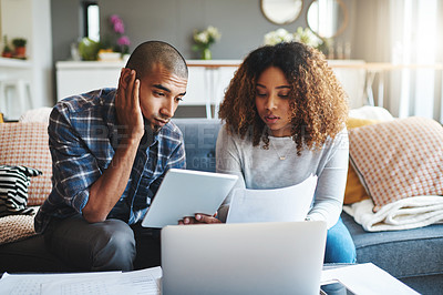 Buy stock photo Stressed, worried and anxious couple doing finances, budget and internet banking. Upset couple looking at savings and online investment. Man and woman struggling with debt, loan and bond payment
